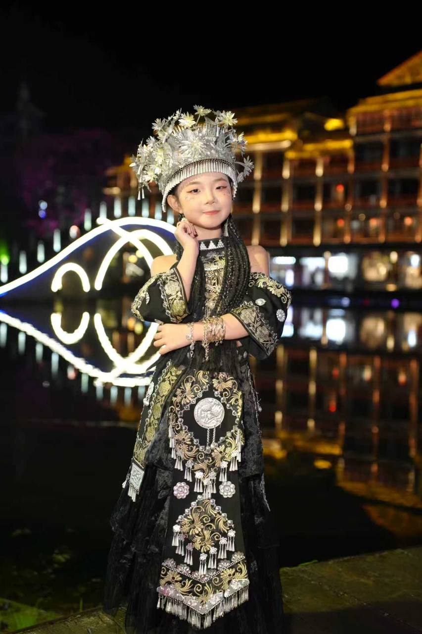 Makayla Wong in traditional Xiangxi Miao tribal dress at a cultural photo shoot in the Miao village